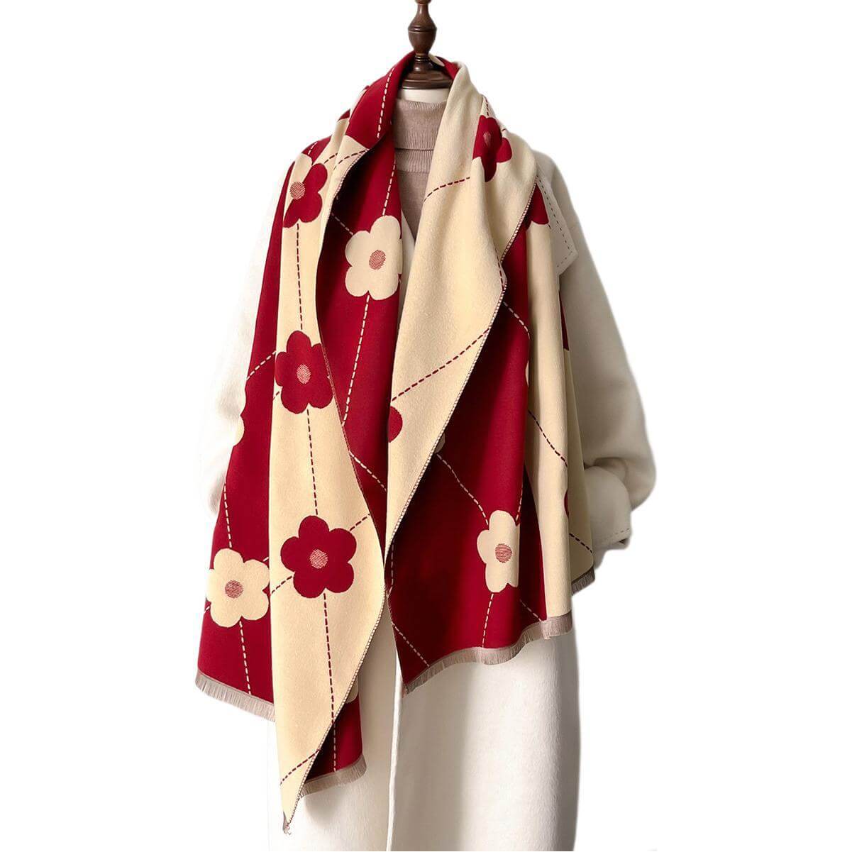 Elegant imitation cashmere scarf with red and cream floral pattern, crafted from high-quality polyester for stylish fashionistas.