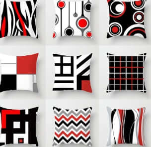 Various decorative pillows for sofa featuring modern geometric patterns in red, black, and white.