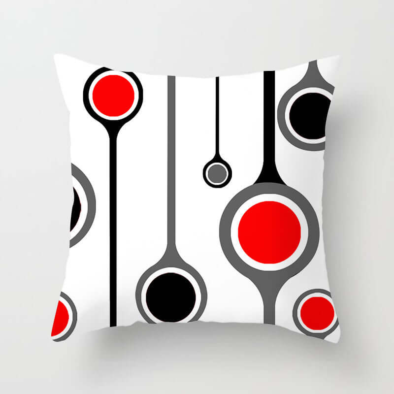Decorative pillow for sofa with red, black, and white abstract design, adding a modern touch to any living room.