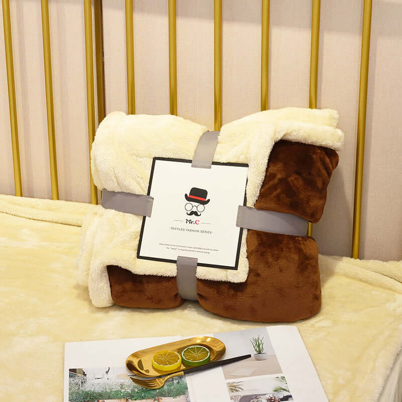 Flannel Plush Blanket in cream and brown, showcasing its cozy design and soft texture for ultimate comfort.