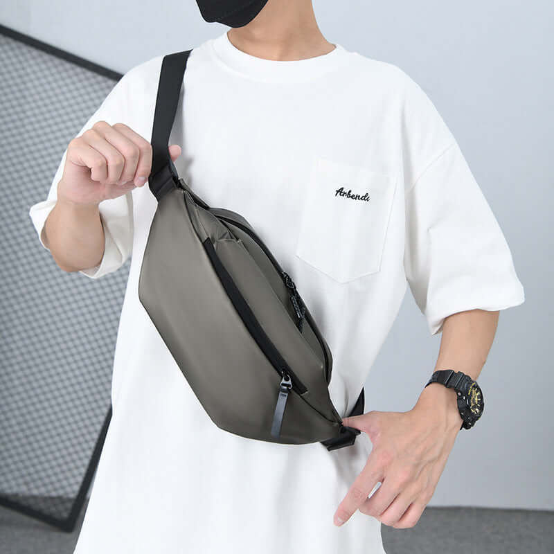 Person wearing a sleek, waterproof High Capacity Waist Bag, ideal for active individuals, providing ample space for essentials.