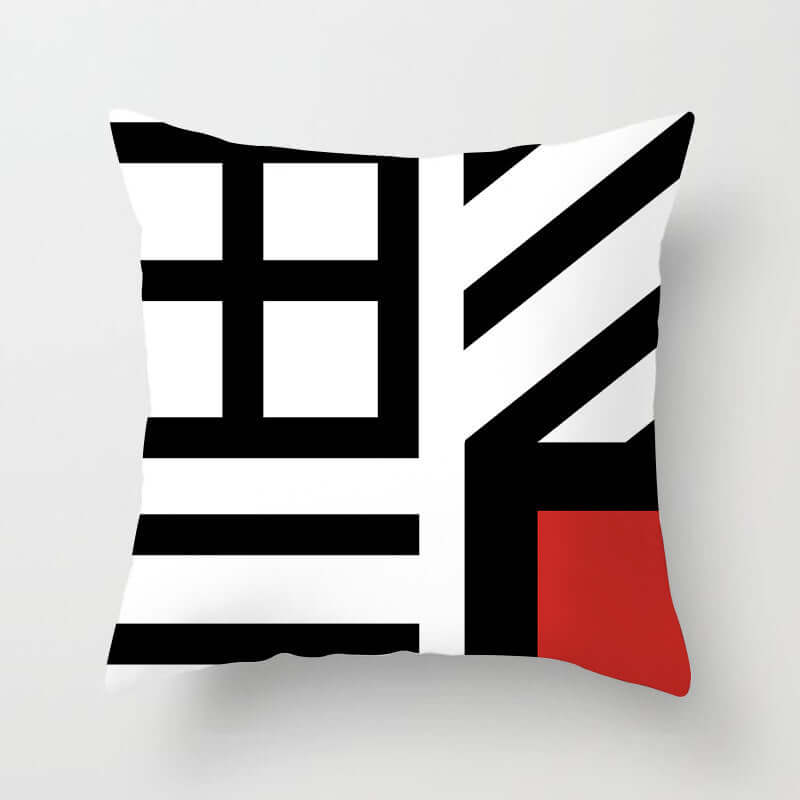 Stylish decorative pillow for sofa featuring a modern geometric design in black, white, and red colors.