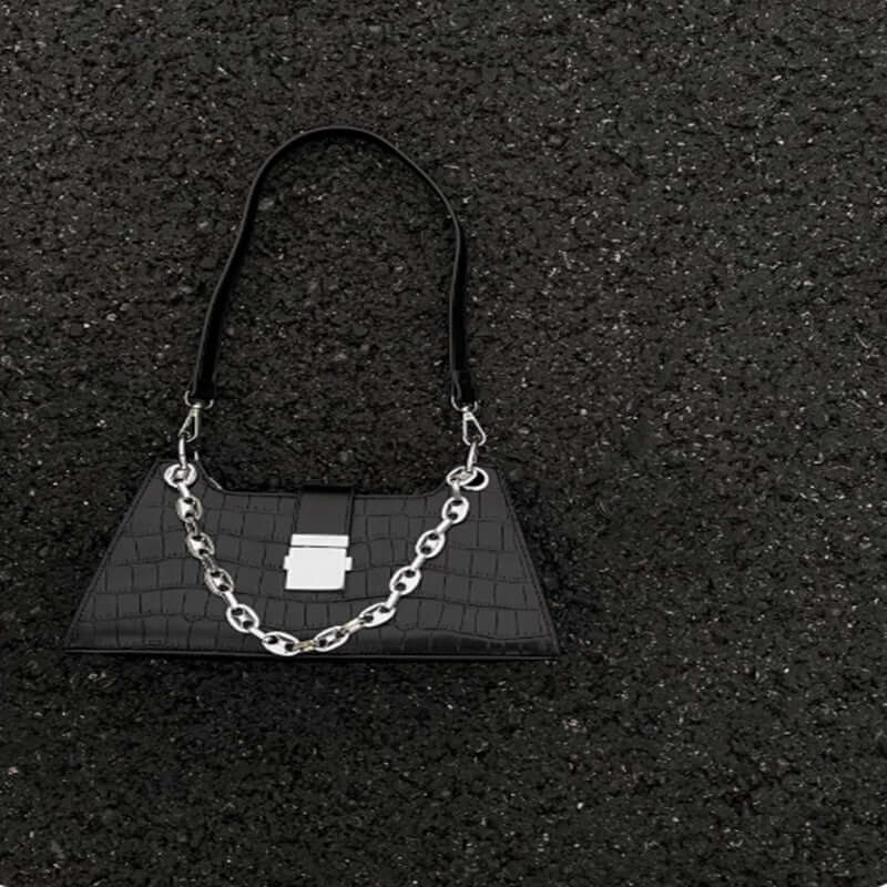 Baguette Handbag in black faux leather with stylish chain detail, medium-sized for essentials, perfect for chic and ethical fashion.