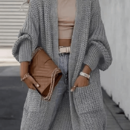 Long sleeve solid color knitted cardigan with open front, perfect for layering, adding comfort and elegance for fall and winter.