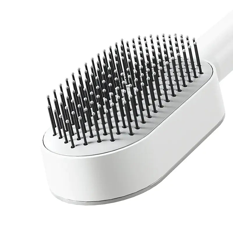 Self-cleaning hairbrush for women with airbag massage function, effortlessly detangling hair, leaving the brush fresh for every use.