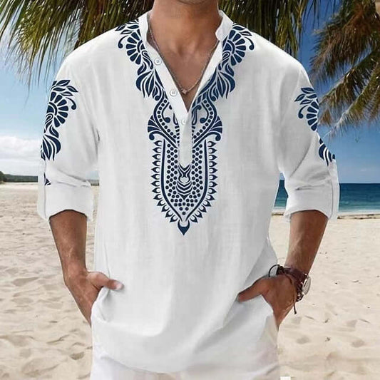 Man wearing stylish white beach long-sleeved shirt with navy embroidery, perfect for seaside adventures on a sunny beach day.