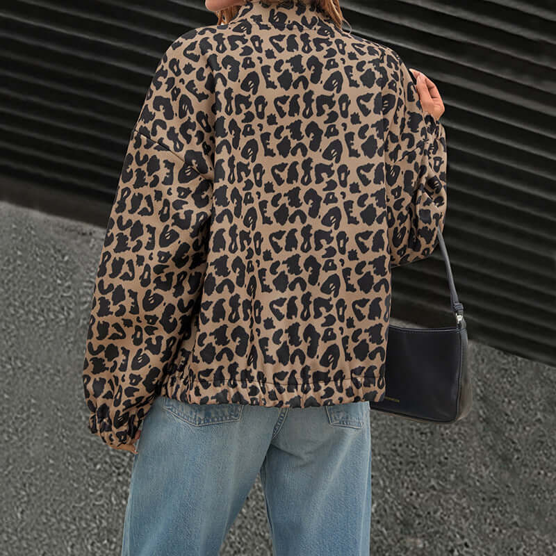 Woman wearing chic Cheetah Print Coat made from premium woolen fabric, paired with jeans and a black purse, showcasing a back view.