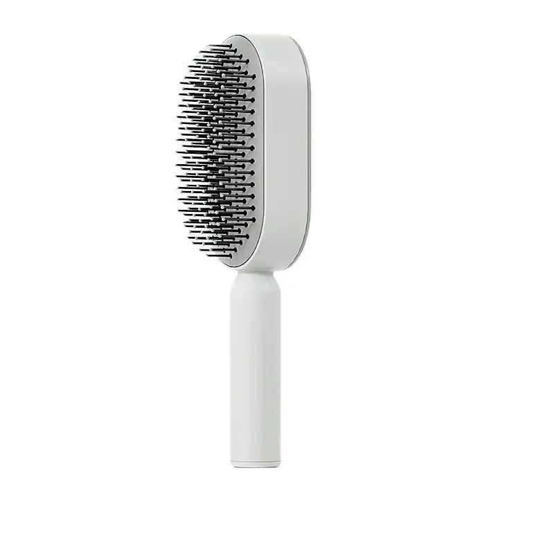 Self-cleaning hairbrush for women with airbag massage function, effortlessly detangling hair, leaving the brush fresh for every use.