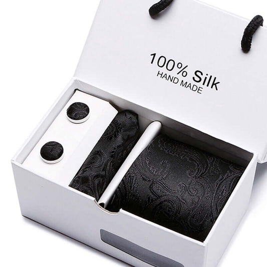 Avant-Garde Tie Set featuring 100% silk handmade tie, cufflinks, and handkerchief for the modern man.