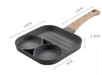 Four Hole Frying Pan with two egg-shaped holes and wooden handle for versatile cooking.