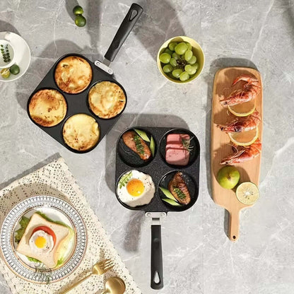 Four Hole Frying Pan with multiple dishes, including eggs and seafood, on a stylish kitchen countertop.