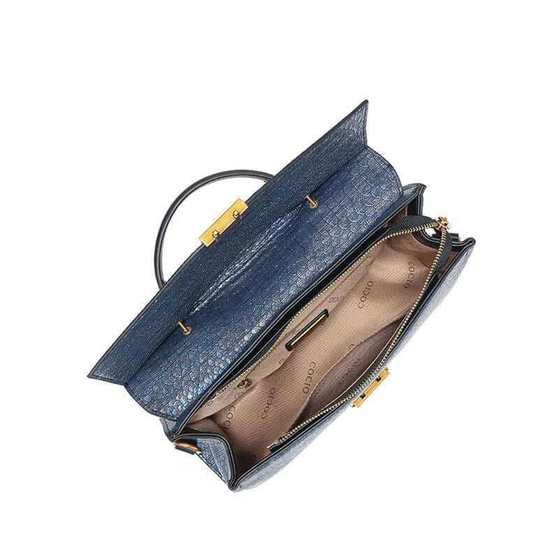Top view of an open ladies leather handbag with a spacious interior, showcasing a luxurious design and high-quality craftsmanship.