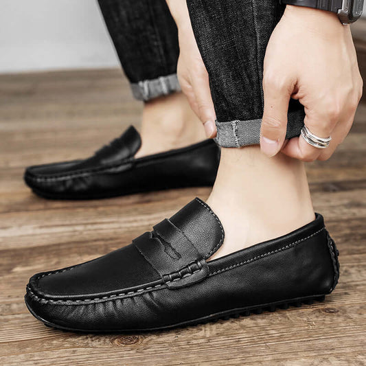 Black Leather Gommino Driving Shoes for men with a solid pattern and durable rubber sole, offering style and comfort.