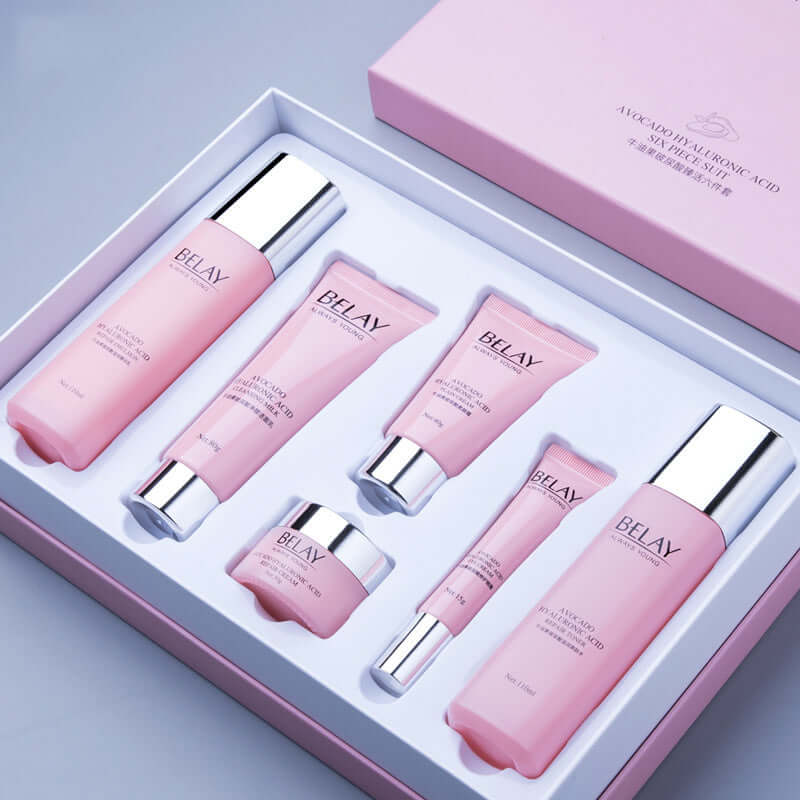 Avocado and Pomegranate Skin Care Creams set for moisturizing and brightening, featuring multiple products in pink packaging.