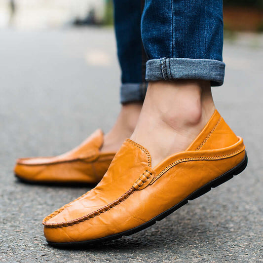 Soft Bottom Leather Loafers in yellow brown with casual design, worn with jeans, showcasing premium craftsmanship and comfort.