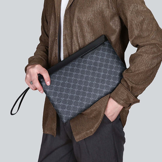 Elegant clutch hand bag in classic black PU material, held by a person in casual wear, showcasing its versatility and style.